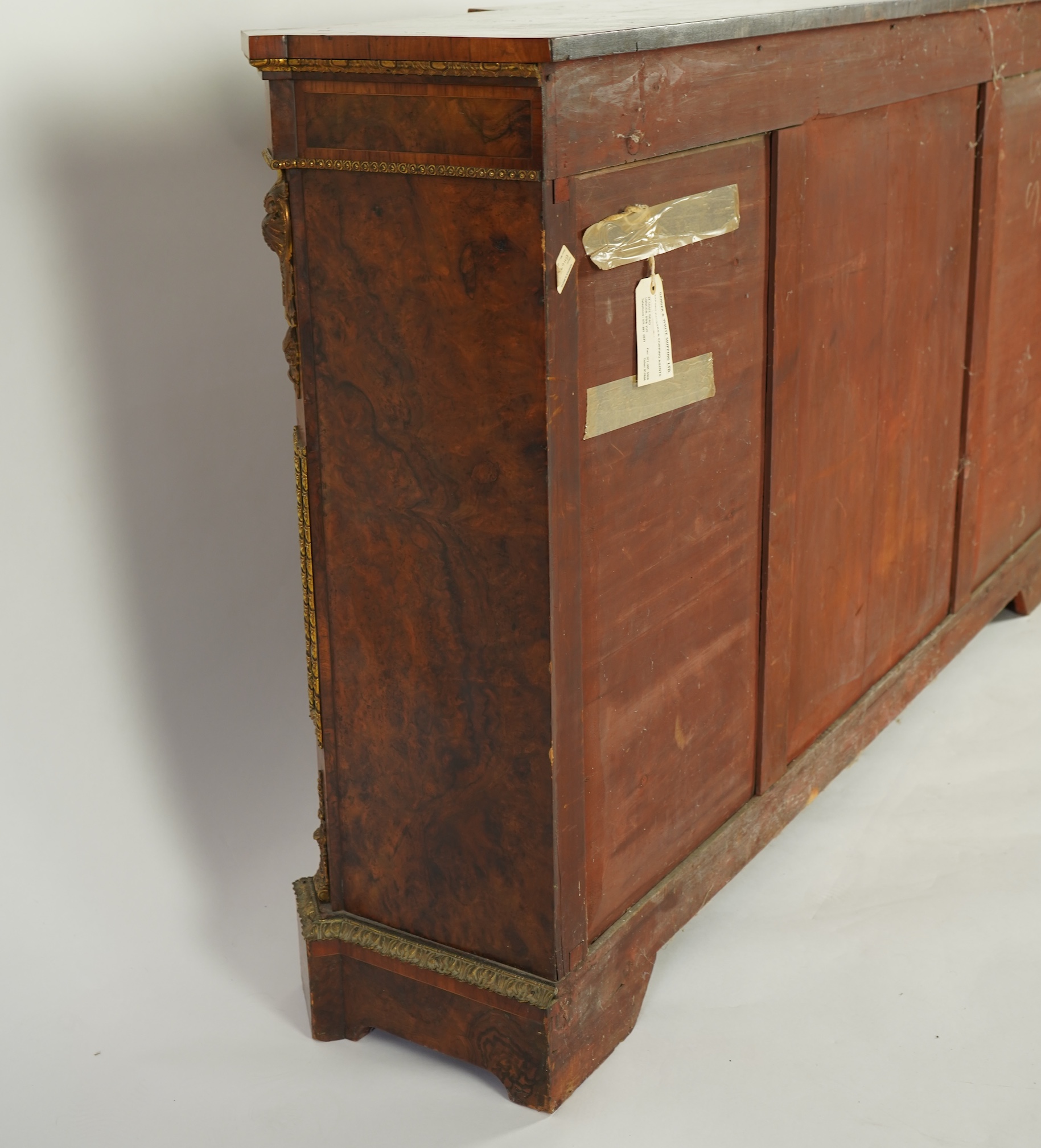 A Victorian tulip banded and gilt metal mounted walnut breakfront side cabinet